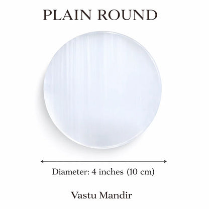 Plain round selenite plate on a clean white background