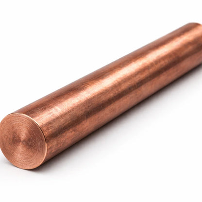 Copper Vastu energy rod in a close-up view against a clean white background