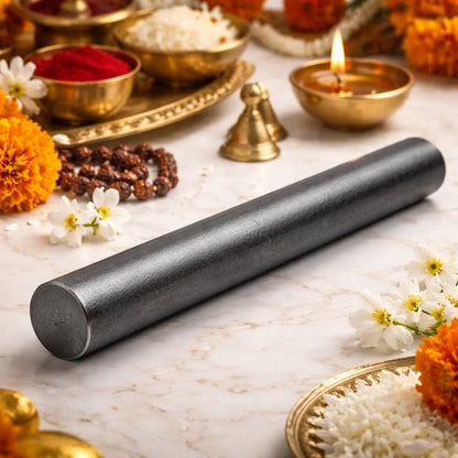 Iron virtual rod displayed beside traditional pooja items