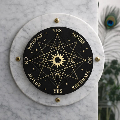 Angled Surya dowsing board showing sun motif, letters and yes-no scale
