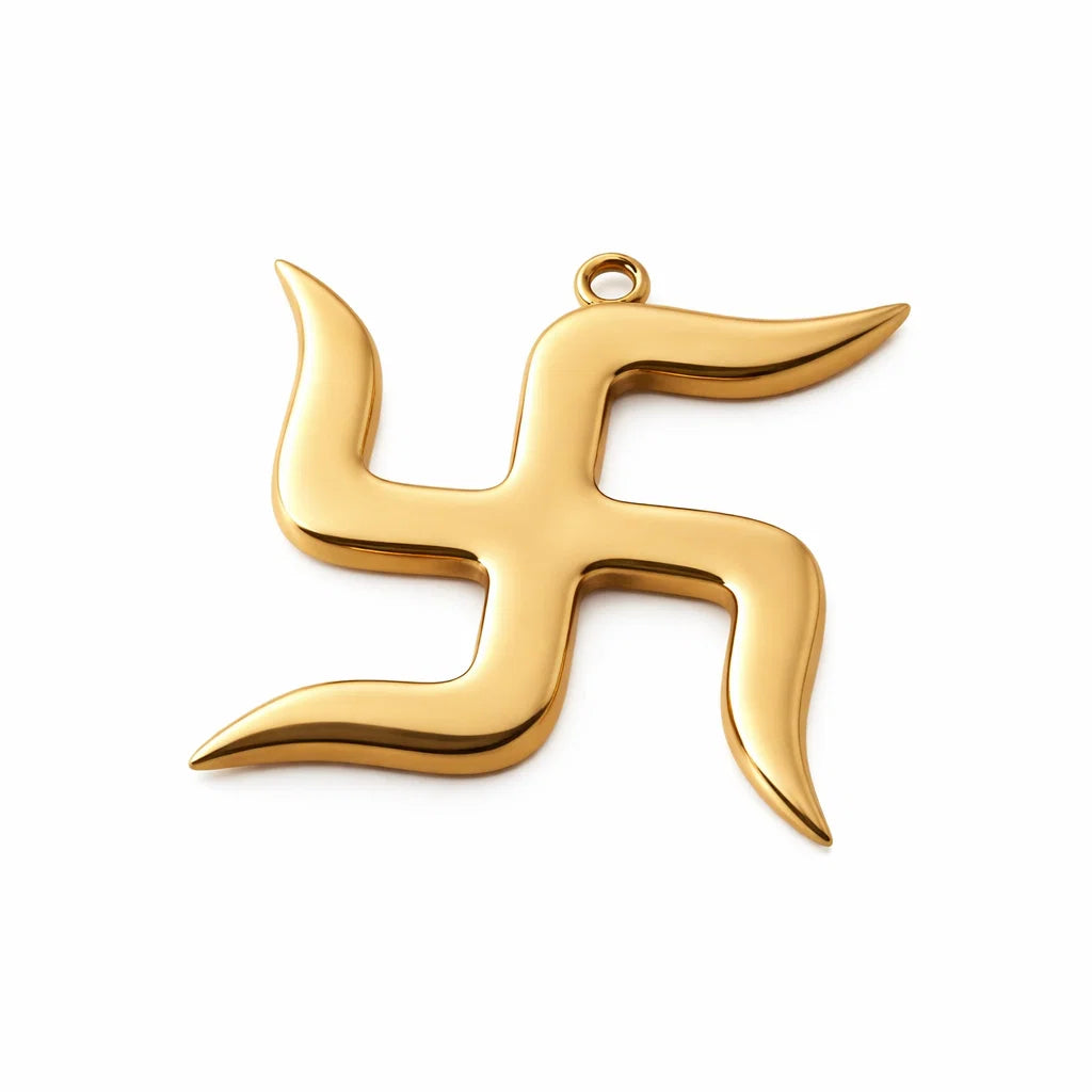 Polished brass Swastik wall symbol displayed at a traditional entrance