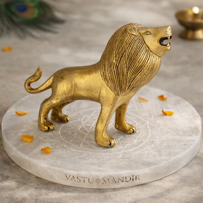 Handcrafted solid brass lion Vastu idol arranged in a styled spiritual setting