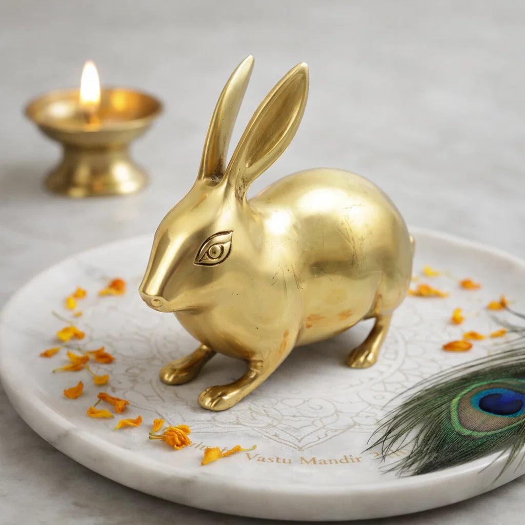 Golden rabbit brass idol arranged in a styled spiritual setting
