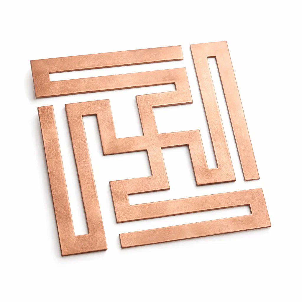 Copper nandavrat Swastik yantra on a clean white background