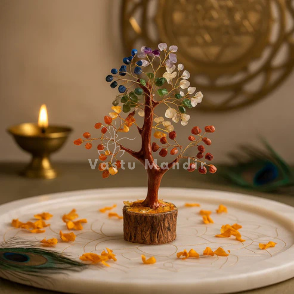 Seven chakra crystal tree arranged in a styled spiritual setting