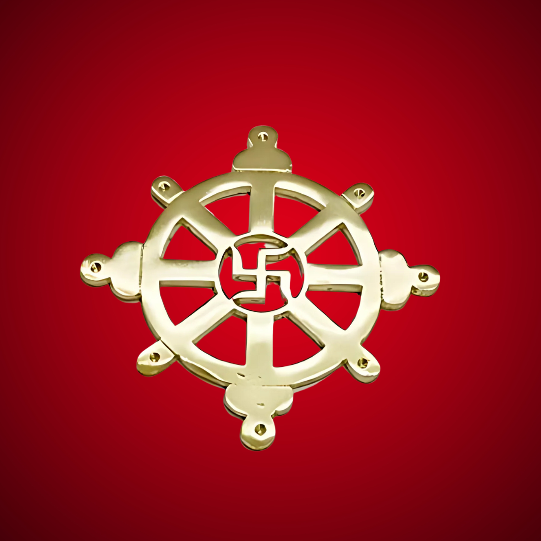 Brass Chakra Satiya symbol centred on a deep red background